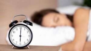 Clock with woman sleeping